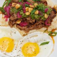 Brisket & Eggs · smoked chopped brisket with tomatillo relish, pickled onions, fried corn kernels, & two sunn...