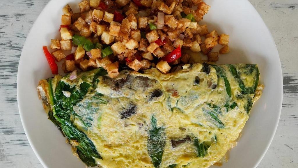 House Omelette · three open range eggs, spinach, shallots, crimini mushrooms, white cheddar cheese & side of skillet potatoes