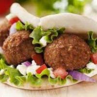 Falafel Sandwich · Served with lettuce, tomato, onions and tahini sauce wrapped in pita bread.