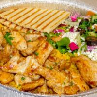 Shawarma Chicken Plate · Served with rice, salad, hummus, pita bread, and garlic sauce.