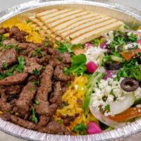 Shawarma Beef Plate · Served with rice, salad, hummus (on the side), pita bread, and tahini sauce.
