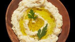Baba Ganoush · Roasted smoked eggplant mashed and mixed with tahini sauce garlic and spices with one pita b...