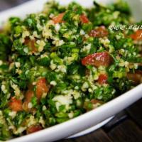Tabouli Salad · Finely chopped parsley, cracked wheat, tomatoes, and olive oil.