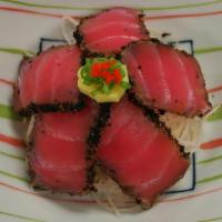 Pepper Tuna · Pan seared tuna rubbed with peppercorns and served with ponzu sauce.
