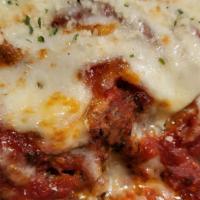 Baked Lasagna · Fresh pasta stuffed with ground beef, mozzarella, ricotta,
and parmesan, topped with our sig...