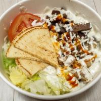 Spicy Gyro Bowl · A bowl of fresh sizzling slices of gyro meat with the customers choice of bowl. Topped with ...