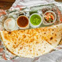 Quesadilla · Your choice of fire braised chicken, steak   – your choice of four or eight slices grilled t...