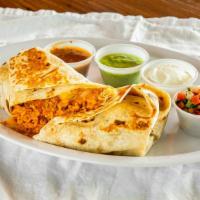 Burrito · Fire braised chicken or  steak – tortilla grilled and stuffed with spanish rice, refried bea...