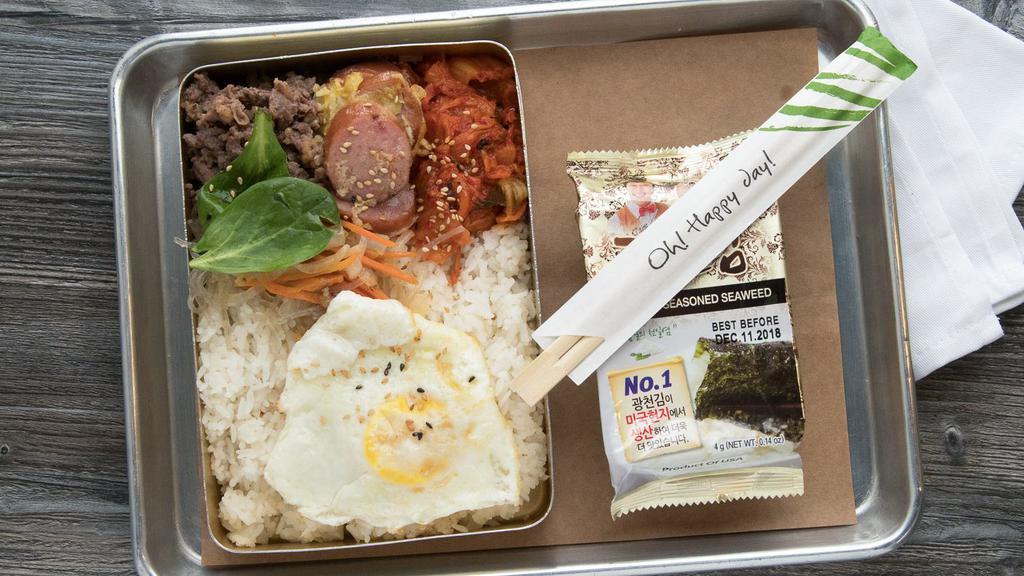 Lunch Box · Rice topped with pan fried egg and sides of chief's choice daily side-dishes.