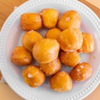 Glazed Donut Holes · Choose to get a half dozen or a dozen glazed donut holes.