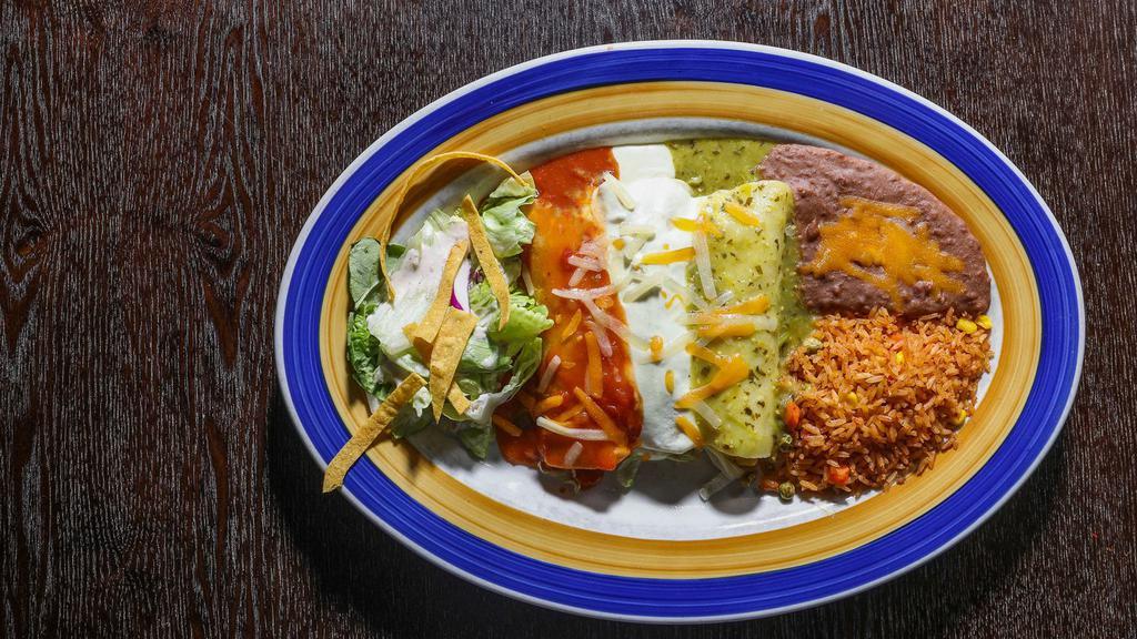 Chicken And Enchiladas · One-quarter pound of mesquite-grilled sliced fajita chicken served over grilled onions and drizzled with chile con queso, with your choice of two enchiladas and any sauce. Served with Mexican rice and sauteed veggies. Cheese, chicken, or beef enchilada.