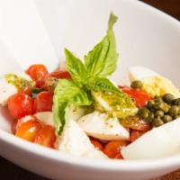 Caprese Clasica · Fresh Mozzarella or imported Provolone cheese with tomato, basil, capers and sliced eggs.