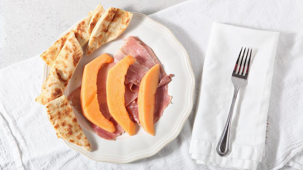 Prosciutto Con Melone · Slices of the classic Italian ham with fresh melon.