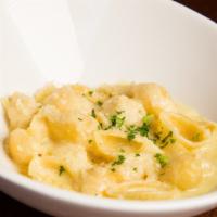 Conchiglie Quattro Formaggi · Pasta shells with a delicate flavor born from the blending of four cheeses: Fontina, Gruyere...