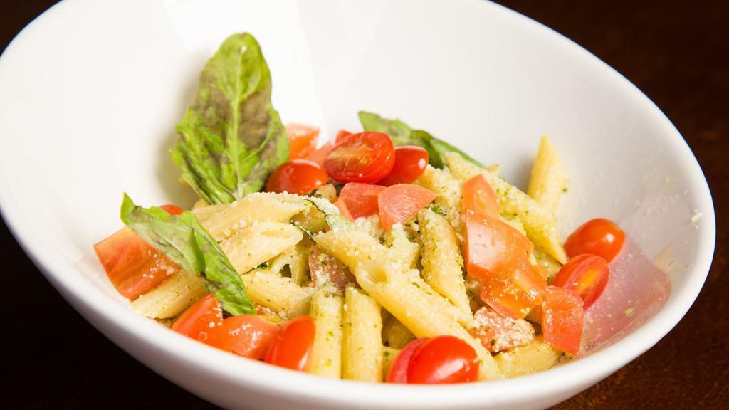 Penne Basilico · Vegetarian. Penne pasta served warm with olive oil and lemon juice, chopped fresh tomato and basil and a spoon of our fresh pesto sauce.