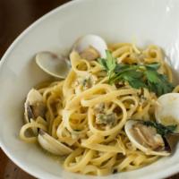 Linguine Alla Vongole · Baby clams cooked in olive oil with garlic and Italian parsley and a bit of lemon with tomat...