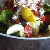 Greek Salad · With feta cheese, sun-dried tomatoes & kalamata olives.