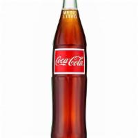 Mexican Coke · The Worldwide King of Soft Drinks. Mexican Coke is made with cane sugar while American Coke ...