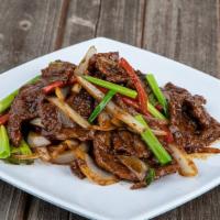 Mongolian Beef · Tender Sliced beef, flash fried with white and green onion, coated with Mongolian sauce.