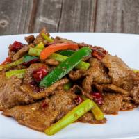 Ingenious Fried Beef · Stir fry sliced beef with green onion and green pepper.