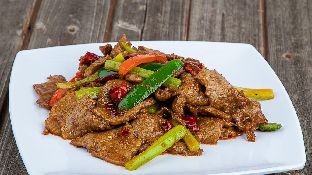 Ingenious Fried Beef · Stir fry sliced beef with green onion and green pepper.