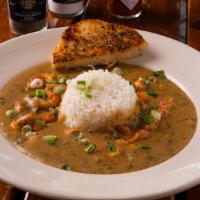Togo Large Crawfish Etouffee · Bowl of Crawfish Tails smothered in a homemade spicy Red Roux with Celery, Onions and Bell P...
