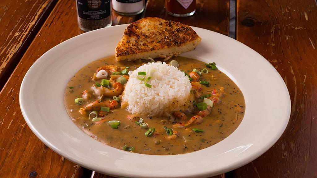 Togo Large Crawfish Etouffee · Bowl of Crawfish Tails smothered in a homemade spicy Red Roux with Celery, Onions and Bell Peppers. Served with Rice.
