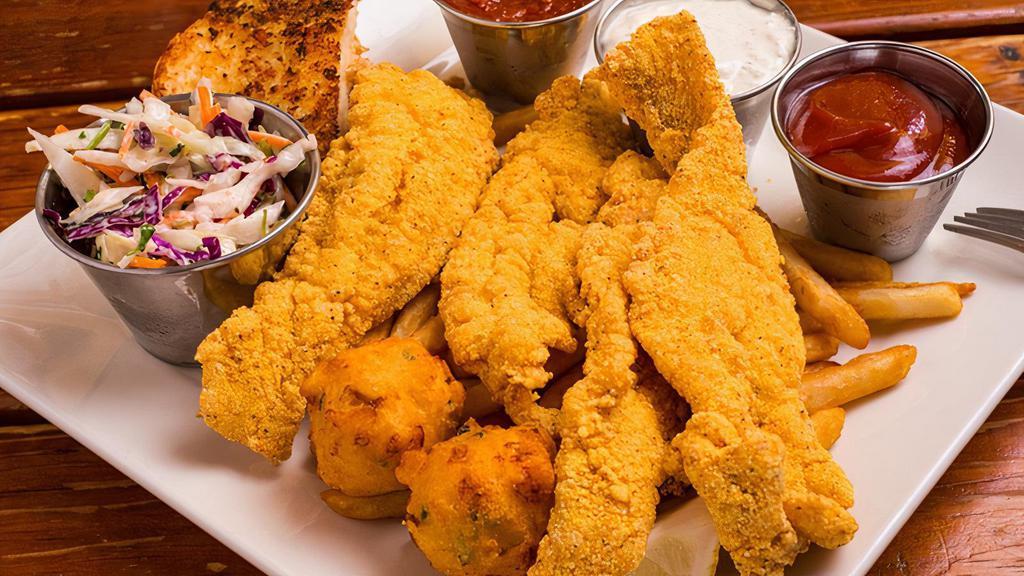 Togo Fried Catfish Plate · Served with Fries, Hush Puppies, Cole Slaw and Garlic Bread.