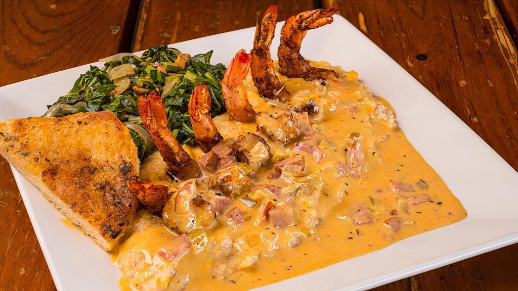 Togo Shrimp & Grits · Jumbo Blackened Shrimp sautéed in a Zesty Andouille Cream Sauce with Celery, Onions, Bell Peppers and choice of Veggie.