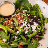 Togo Mad Hatter · Baby Leaf Spinach, Pecans, Dried Cranberries, Feta Cheese, Green Peppers, Onion, and Tomato....