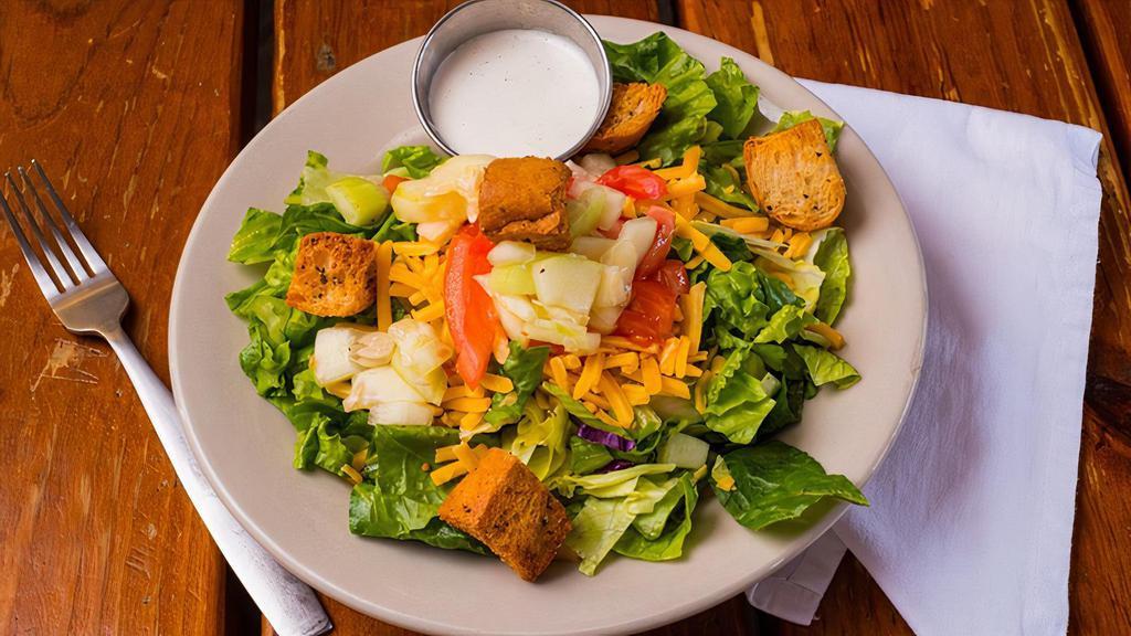 Togo Side Salad · Mixed greens, cucumbers, tomatoes, cheddar cheese, and leidenheimer croutons. Choice of dressing.
