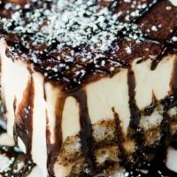 Tiramisu · Ladyfingers dipped in espresso liqueur, layered with sweet mascarpone, and dusted chocolate ...