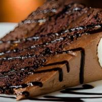 Chocolate Mousse Cake · A triple-layered chocolate cheesecake, mocha chocolate cake, and chocolate mousse, topped wi...