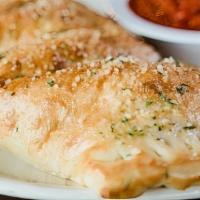 Build Your Own Stromboli · Oven-baked dough stuffed with your choice of toppings. Brushed with garlic butter and parmes...