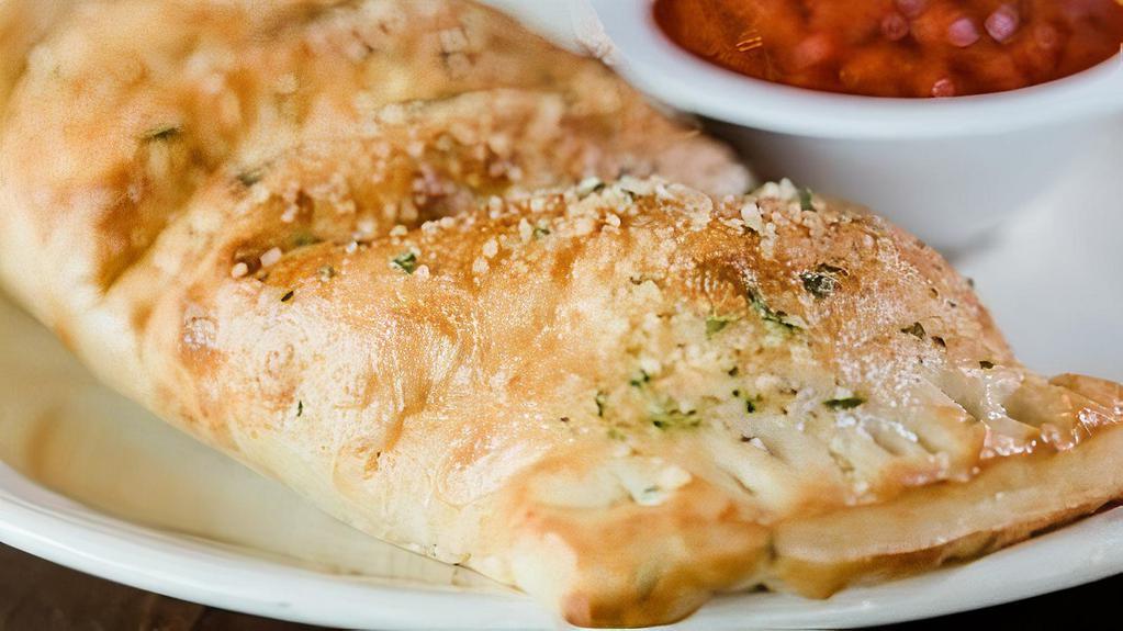 Build Your Own Stromboli · Oven-baked dough stuffed with your choice of toppings. Brushed with garlic butter and parmesan, served with marinara.