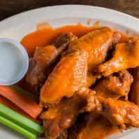 Traditional Wings · Fried in pure canola oil. Includes celery, carrots, and choice of blue cheese or ranch dress...