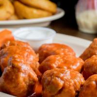 Boneless Wings · Hand breaded daily and fried in pure canola oil. Includes celery, carrots, and choice of blu...