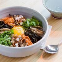 Bibimbap · It combines rice, meat, egg, and a variety of other seasoned vegetables served with homemade...