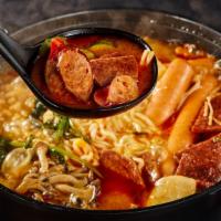 Korean Army Hot Pot · Ingredients: Homemade kimchi base, sausage, ham, spam, bacon, and rice cake with assorted ve...