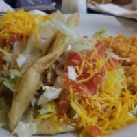 Crispy Tacos Plate · Two crispy tacos filled with ground beef or shredded chicken, topped with lettuce, tomato, a...