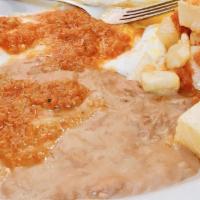 Huevos Rancheros Plate · Two eggs cooked any style topped with ranchero sauce.