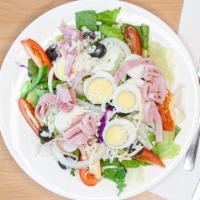 Chef Salad · Mixed lettuce, ham, cheese, boiled eggs, onions, bell peppers, tomatoes and black olives.