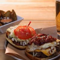 Rise & Shine Burger · Angus beef, hash browns, fried egg, bacon, American cheese, spicy cranberry ketchup, lean gr...