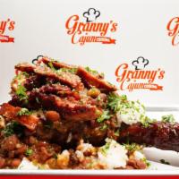 The Cajun Classic · Cajun Seasoned and Smoked Turkey Leg stuffed with Red Beans and Rice and topped with Cajun L...