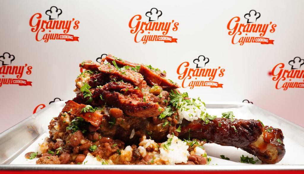 The Cajun Classic · Cajun Seasoned and Smoked Turkey Leg stuffed with Red Beans and Rice and topped with Cajun Link