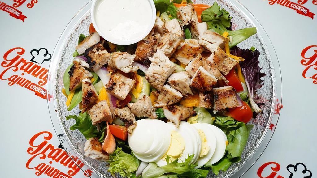 Granny'S Tossed Salads W/Fried Chicken · Spring Mix topped with Tomato, Cheese, Bacon, Boiled Egg and your choice of dressing. Topped with Chicken
