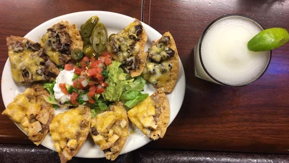 Super Nachos · Individually prepared bean and cheese nachos topped with fajita beef or chicken fajita. Served with a scoop of guacamole, sour cream and pickled jalapenos.