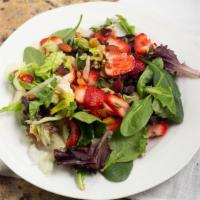 Ensalada De Fresa · Vegetarian. Fresh strawberries, honey roasted almonds and walnuts served on a bed of spinach...