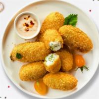 Jalapeno Poppers · (Vegetarian) Six pieces of fresh jalapenos coated in cream cheese and fried until golden bro...