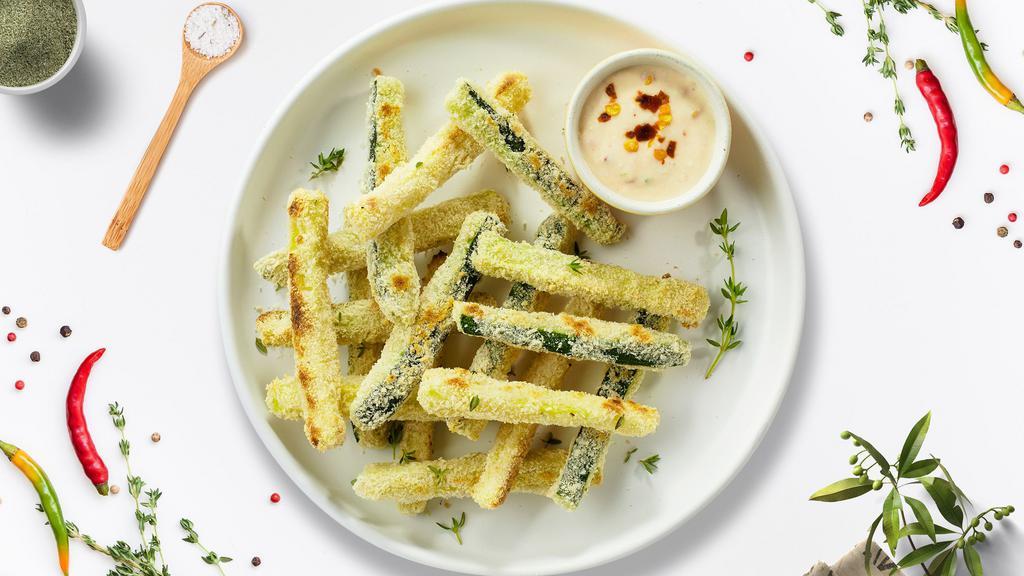 Fried Zucchini · (Vegetarian) Ten pieces of sliced zucchini breaded and fried until golden brown.